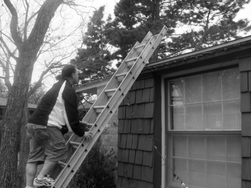 Pops putting up Christmas lights for you. This was his first time putting up lights.